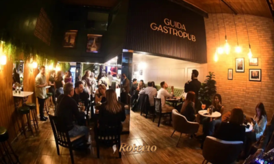 Ambiente interno do Guida Gastropub SJC lotado durante a noite — um dos melhores restaurantes do Vale do Paraíba em São José dos Campos