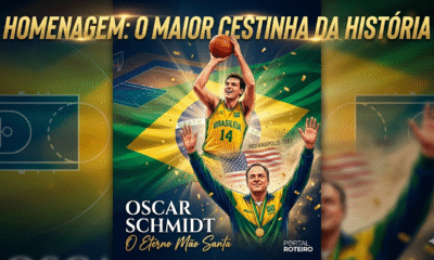 Ilustração fotográfica vertical e vibrante de Oscar Schmidt, o "Mão Santa". No topo, o texto dourado "HOMENAGEM: O MAIOR CESTINHA DA HISTÓRIA". Em primeiro plano, o jovem Oscar arremessa uma bola com a camisa amarela número 14 do Brasil. Atrás dele, ele aparece sorrindo e comemorando a vitória do Pan de 1987, com a medalha de ouro no peito. O fundo é uma quadra de basquete com a bandeira brasileira e confetes dourados. No canto inferior, o nome "OSCAR SCHMIDT (1958 - 2026)" e a logo do "PORTAL ROTEIRO".
