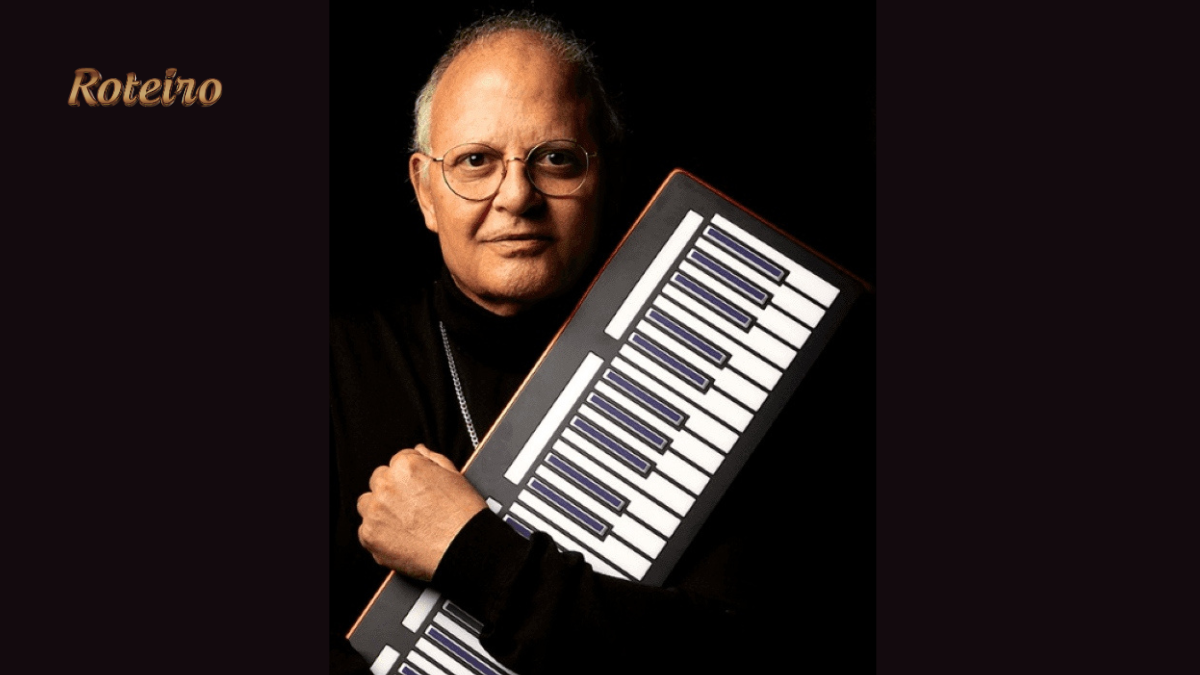 Guilherme Arantes segurando teclado portátil em foto de divulgação da turnê 50 Anos Luz em SJC