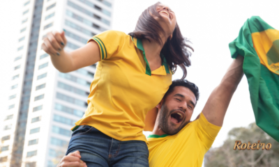 Onde assistir Copa SJC — torcedores comemoram com a bandeira do Brasil em São José dos Campos