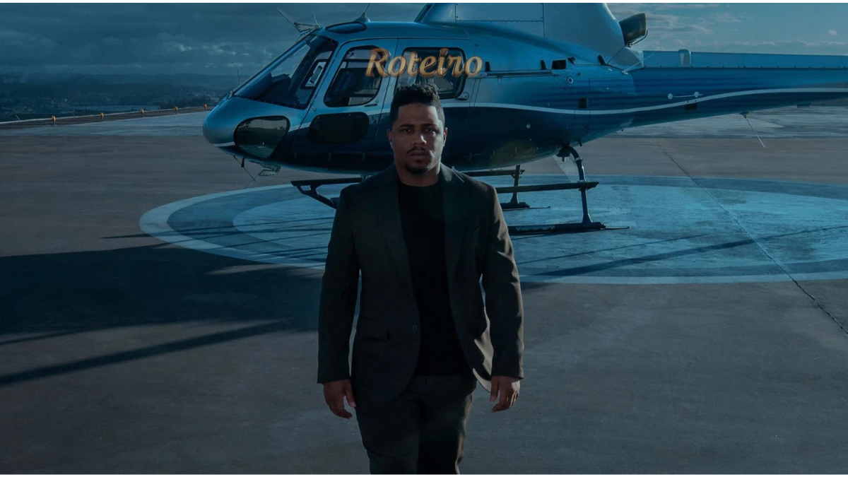 Nando Entre Dois Mundos: Christian Malheiros como Nando em cena ao lado de helicóptero