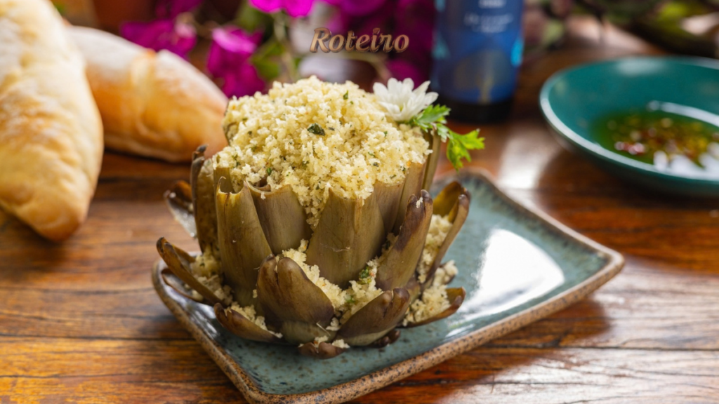 Festival da Alcachofra 2026: flor de alcachofra com farofa de pão, alho e azeite servida em prato azul
