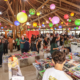 FLIG 2026 em Guararema, pavilhão de livros na Ilha Grande decorado com lanternas coloridas