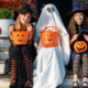 Halloween em SJC 2026, crianças fantasiadas de bruxa e fantasma com baldes de abóbora