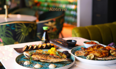 Restaurant Week São Sebastião peixe grelhado e frango assado com legumes em mesa de restaurante